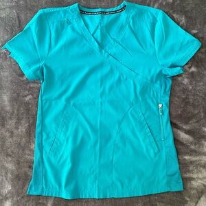 Koi bright teal scrub top